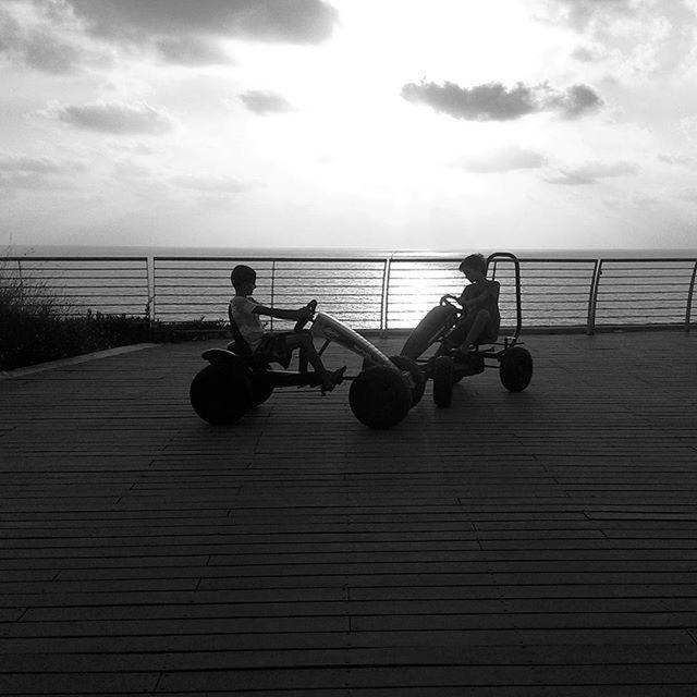 sky, sea, horizon over water, water, transportation, lifestyles, men, bicycle, cloud - sky, leisure activity, mode of transport, beach, full length, cloud, tranquility, scenics, tranquil scene