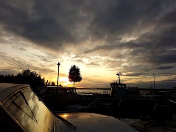 Silhouette of city against sky during sunset