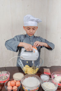 High angle view of boy having food on table