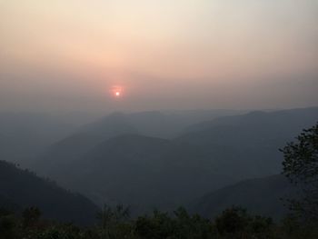 Scenic view of mountains against sky during sunset