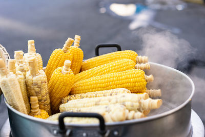 Close-up of yellow corn cobs steaming 