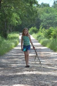 Full length of woman walking on road