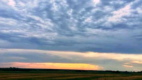 Scenic view of dramatic sky over land