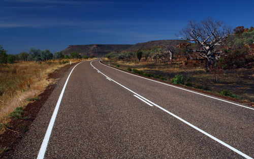 Road amidst landscape against sky