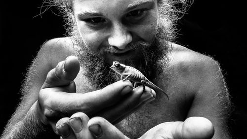 Man holding chameleon