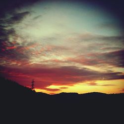 Silhouette of landscape against dramatic sky