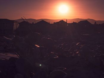 Scenic view of silhouette mountains against sky during sunset