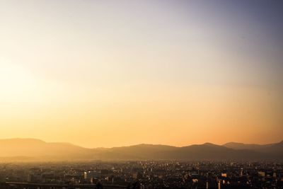 Cityscape against sky during sunset