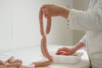 Midsection of woman preparing food