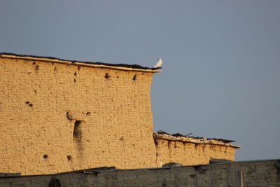 Low angle view of fort against clear sky