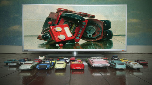 Red toy car on table