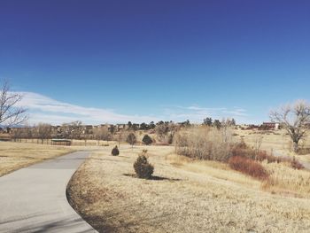 Panoramic view of landscape against clear blue sky
