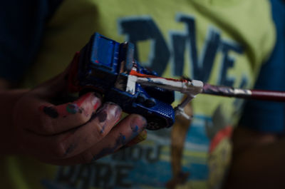 Close-up of hand holding camera