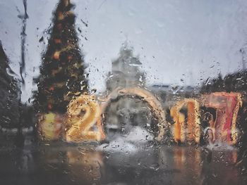 Close-up of wet car window in rainy season