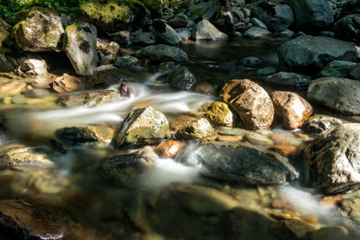 Water flowing through rocks in river