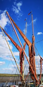 Low angle view of thames barge against sky