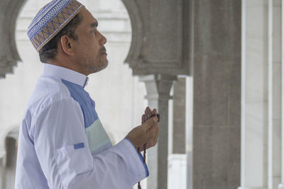 Man praying in mosque