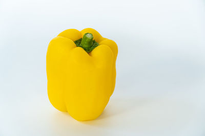 Close-up of yellow bell pepper against white background