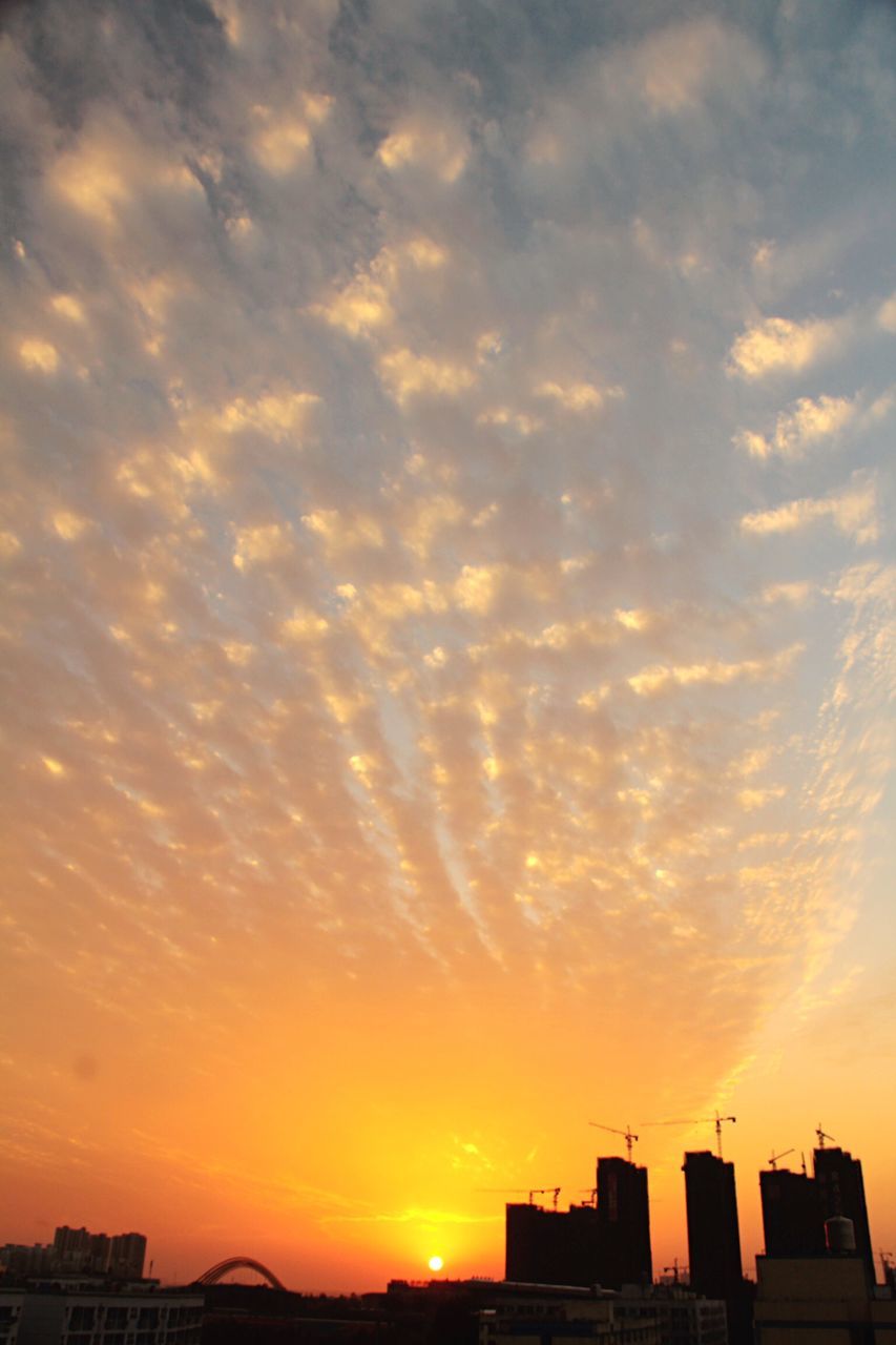 sunset, building exterior, architecture, built structure, silhouette, sky, orange color, cloud - sky, city, low angle view, sun, residential structure, residential building, building, house, beauty in nature, cloud, sunlight, nature, scenics