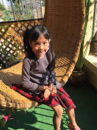 High angle view of young woman sitting on street