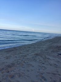 Scenic view of beach against clear sky