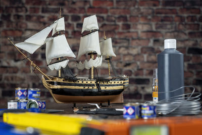 Model ship building handcraft on table with different materials