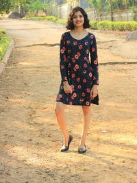 Portrait of a teenage girl standing outdoors