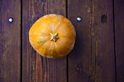 High angle view of pumpkins on wooden table