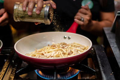 Midsection of man preparing food