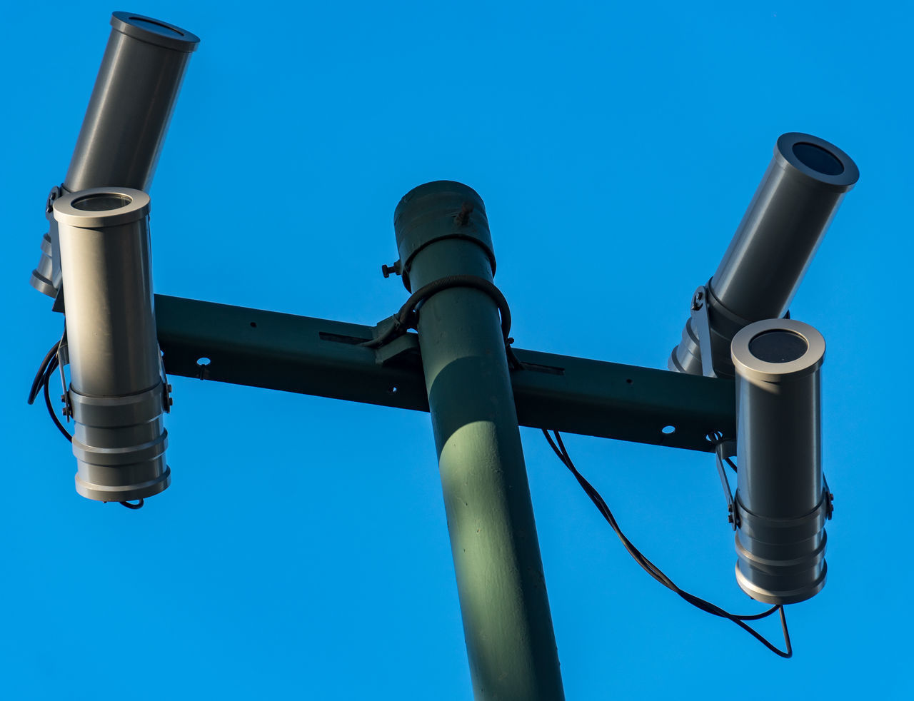 LOW ANGLE VIEW OF ELECTRIC LAMP AGAINST BLUE SKY