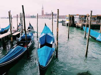 Boats moored in canal