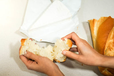 Cropped hand of person holding food