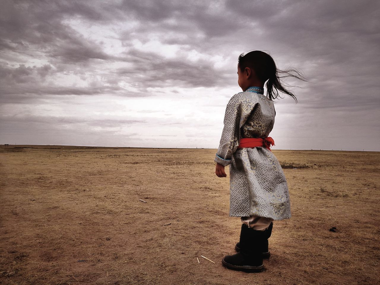 GIRL STANDING ON LANDSCAPE