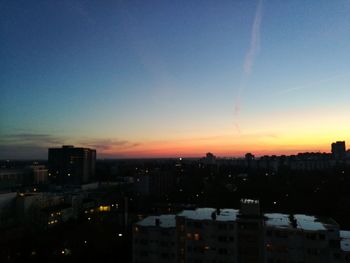 Cityscape against sky during sunset