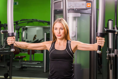 Young woman with arms outstretched