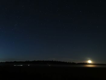 Scenic view of star field against sky at night