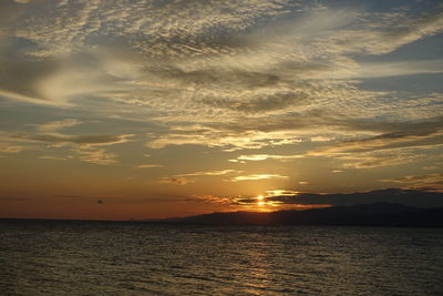 Scenic view of sea against sky at sunset