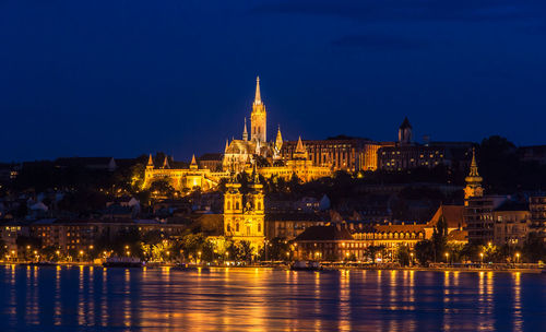 Illuminated buildings at waterfront