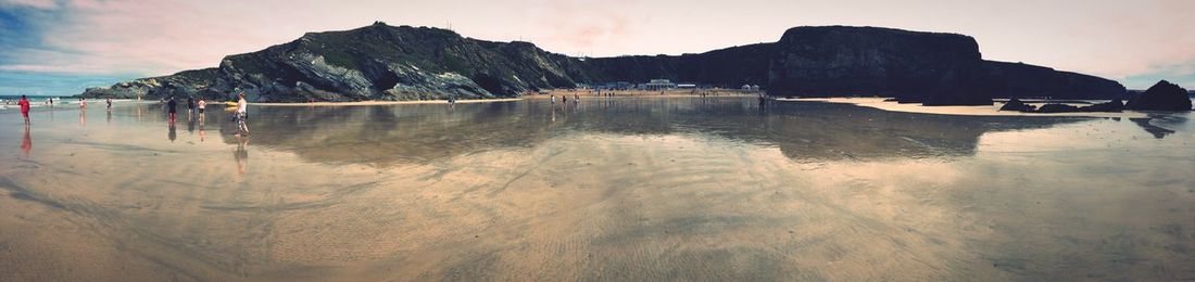 Panoramic view of people at beach