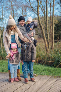 Rear view of people against wall