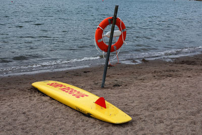 Information sign hanging on beach