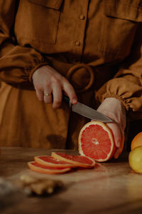 Midsection of man preparing food