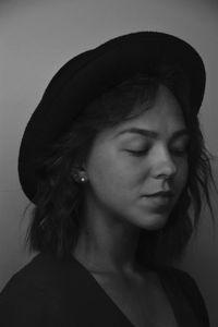 Close-up portrait of a young woman looking away