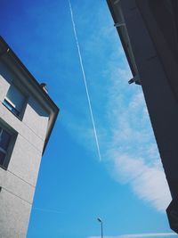 Low angle view of buildings against blue sky