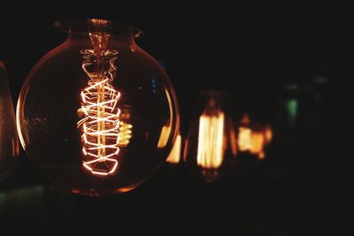 Close-up of illuminated light bulb