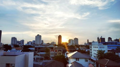 Modern buildings in city against sky