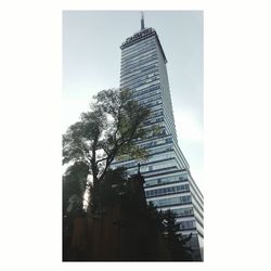 Low angle view of skyscrapers against clear sky