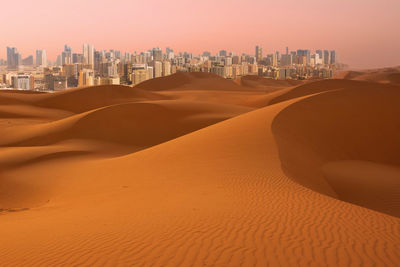 Panoramic view of desert against clear sky