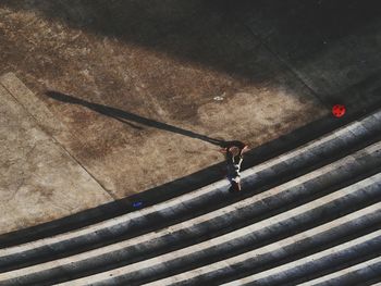 High angle view of boy playing on street