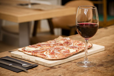 Close-up of wine in glass on table